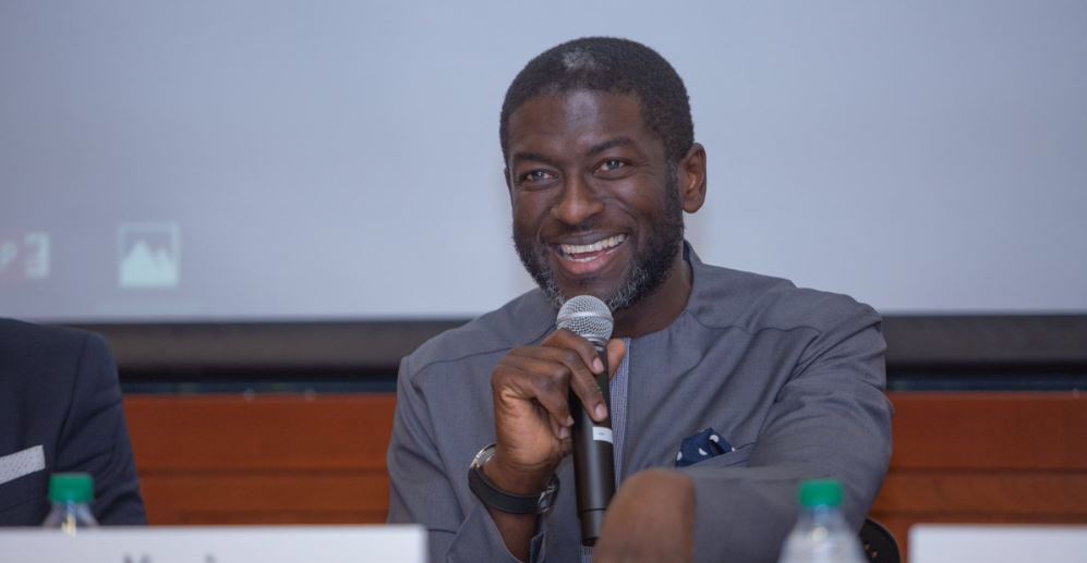 Kevin Okyere speaking at an event.
