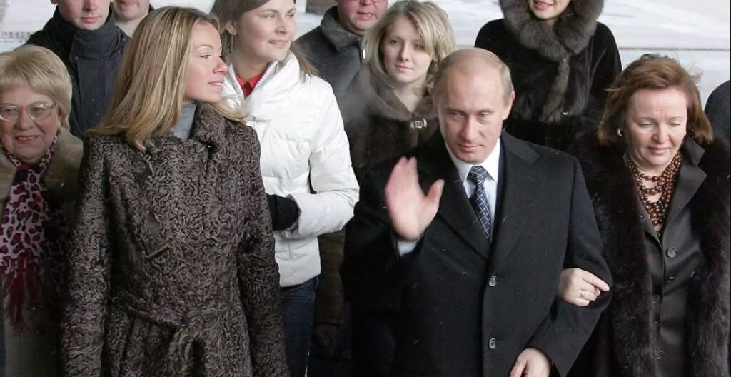 From left, front: Vladimir Putin's daughter Maria with him and mother Ludmila in 2007. ALEXANDER NEMENOV/AFP VIA GETTY