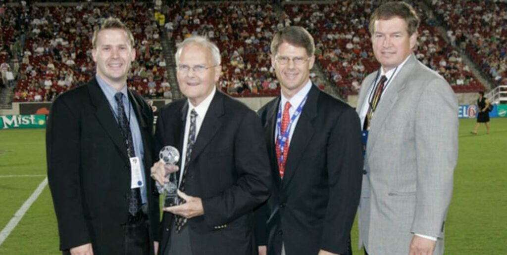 Lamar Hunt posing with his sons