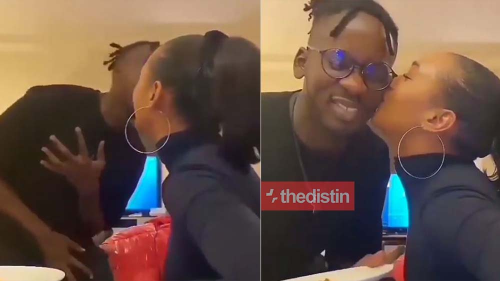 Video of multiple award-winning Nigerian singer Mr. Eazi chopping love with his girlfriend Temi Otedola as she kisses him