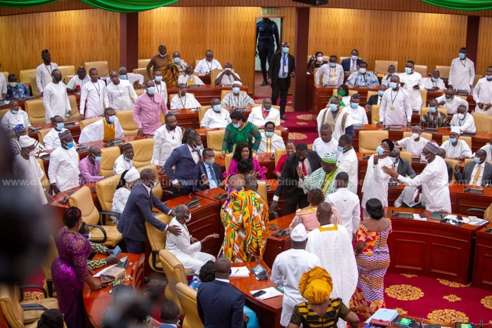 Pictures of MP for Ablekuma West, Ursula Owusu-Ekuful on the floor at the dissolution of the 7th parliament and the inauguration of the 8th Parliament of Ghana's 4th Republic as NDC and NPP MPs fight over majority side of parliament.