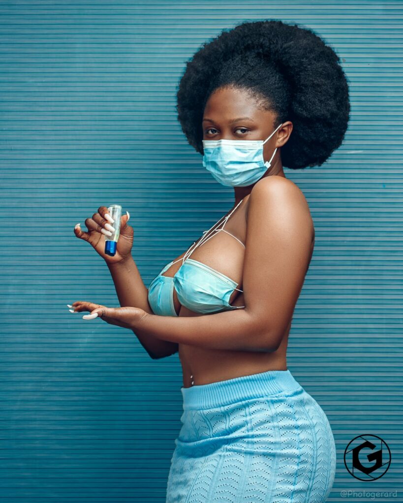Ghanaian photo model, Dezel The Model shows creativity as he poses in eye-catching pictures using nose masks as her bra.