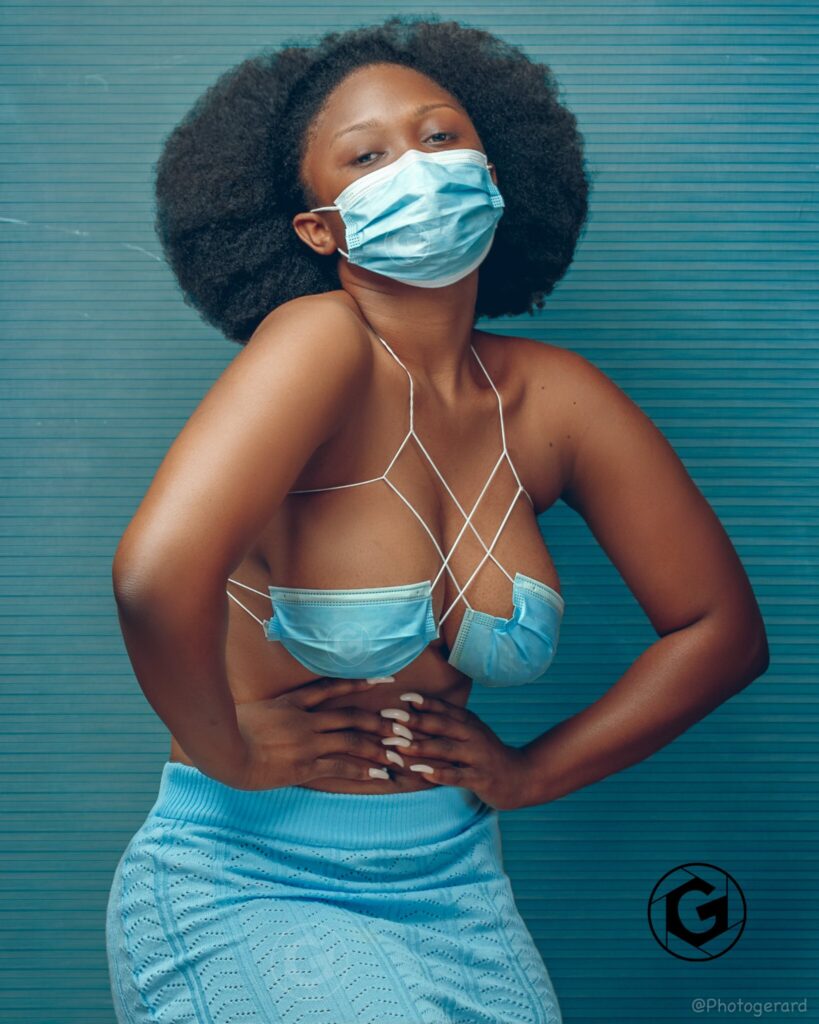 Ghanaian photo model, Dezel The Model shows creativity as he poses in eye-catching pictures using nose masks as her bra.