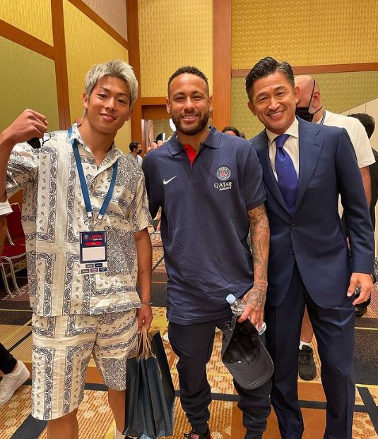 World's oldest footballer Kazuyoshi Miura (R), his son Kota Miura (L) and Neymar

