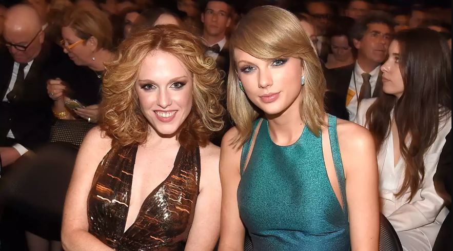 Taylor Swift (R) and Abigail Anderson attend The 57th Annual GRAMMY Awards