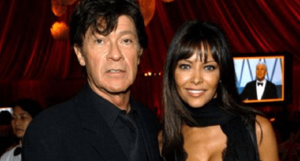 Robbie Robertson with his partner. Image Source: Fanmuse
