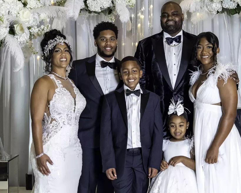 Michael Oher and his wife, Tiffant Roy, on their wedding day with their kids. PHOTO: MICHAELOHER INSTAGRAM