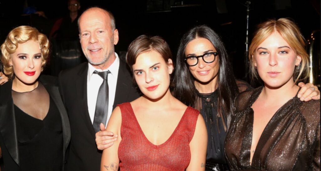 Demi Moore (in shades) with Bruce Willis and their daughters. Image Source: Getty