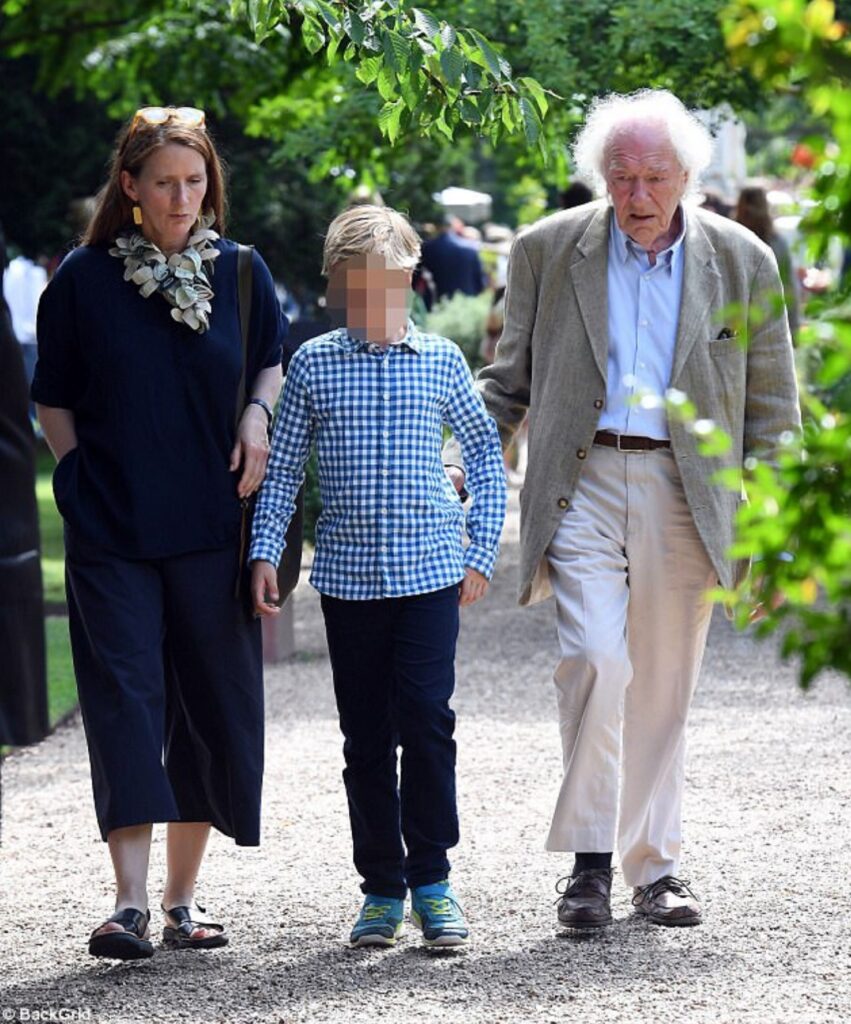 Sir Michael Gambon with his girlfriend Philippa Hart and their son. Image Source: BackGrid.