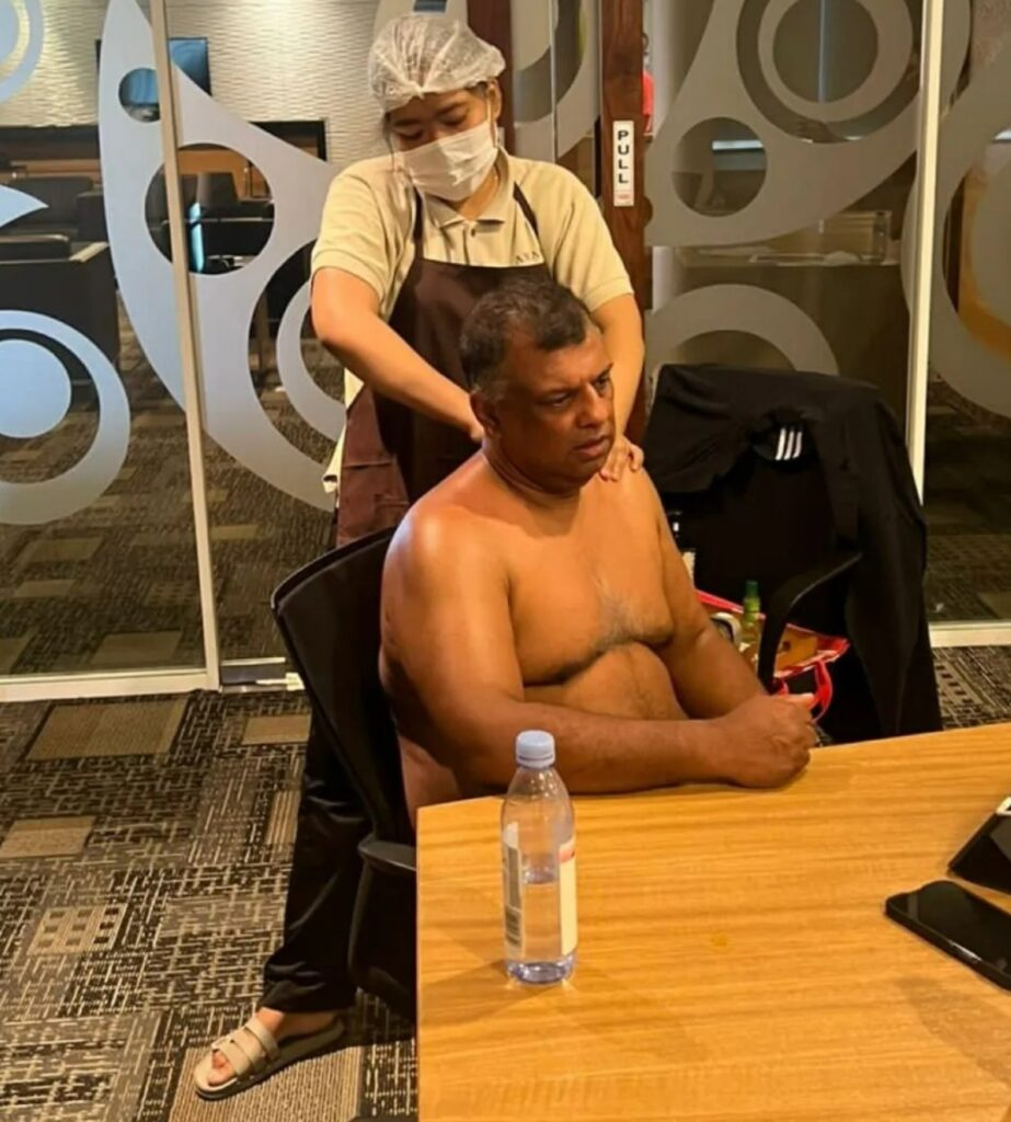Tony Fernandes stunned fans by having a topless massage in his office