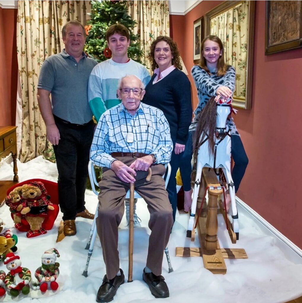 Captain Tom with his family in Christmas 2019 Credit: TWITTER/CAPTAIN TOM MOORE
