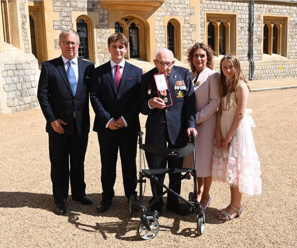 Colin Ingram-Moore (left) with his father-in-law Captain Sir Tom Moore, and wife Hannah, right, son Benji and daughter Georgia