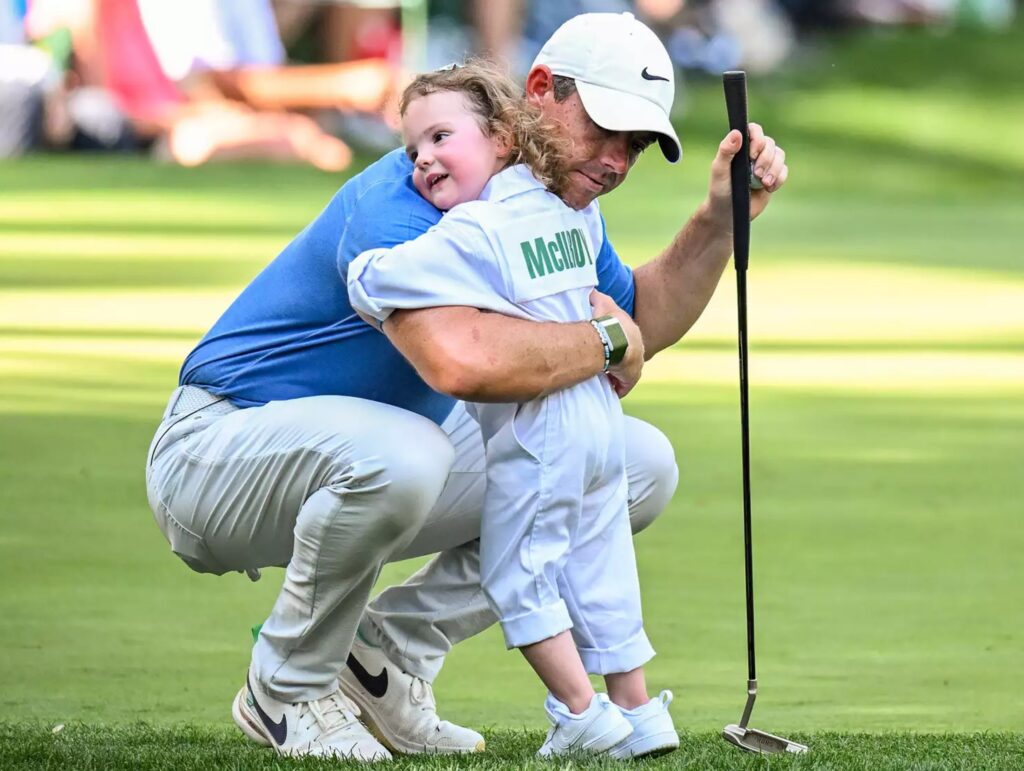 Rory McIlroy and his daughter Poppy on the ninth hole during the Par 3 Contest prior to the 2023 Masters Tournament. KEYUR KHAMAR/PGA TOUR/GETTY
