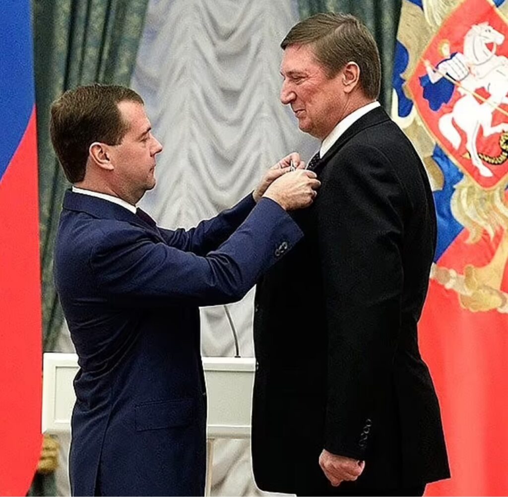 Nekrasov is presented with an honour by former Russian president Dmitry Medvedev

