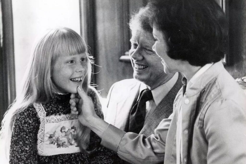 Washington, D.C.: Amy Carter with her father Jimmy and mother Rosalynn Carter in a family suite at the Americana Hotel in Washington, D.C. on July 14, 1976. (Photo by Dick Yarwood/Newsday RM via Getty Images)