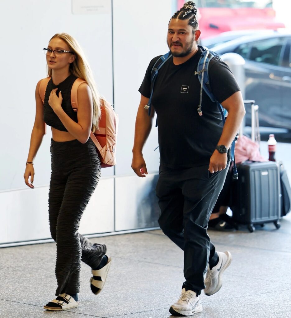 Castro (right) was seen wearing a black T-shirt and black sweats with white Nikes as he walked with a mystery woman. Image Credit: Clint Brewer Photography / A.I.M / BACKGRID