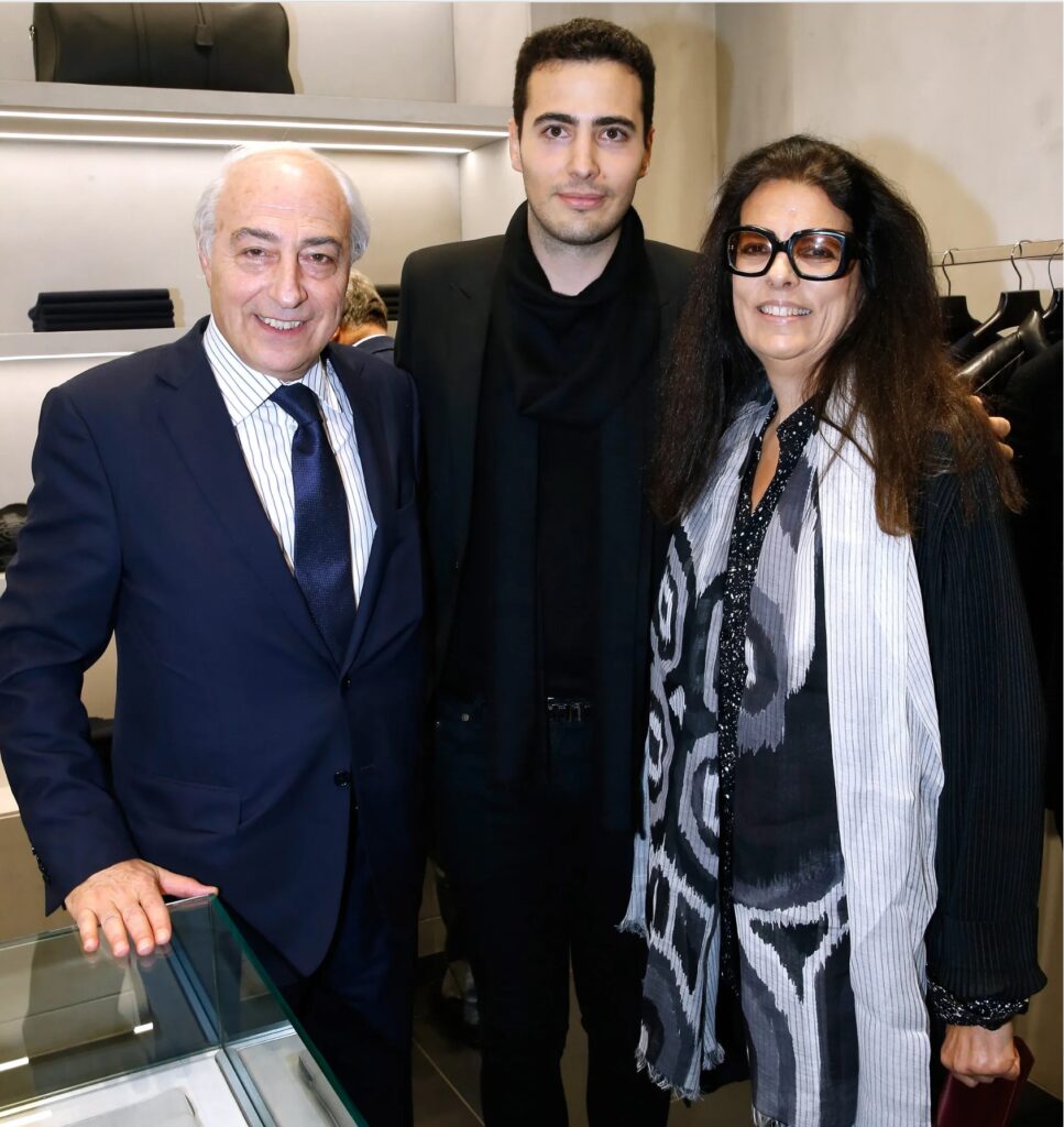 Jean-Victor Meyers stands between his parents Jean-Pierre and Françoise at his company's storefront on October 29, 2015, in Paris, France