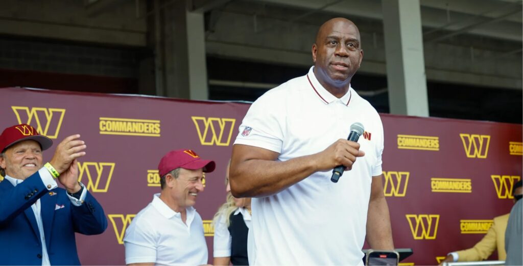 NBA legend Magic Johnson reaches billionaire status thanks to a majority stake in insurance company. He has added the NFL's Washington Commanders to his business empire. Credit: 2023 Getty Images