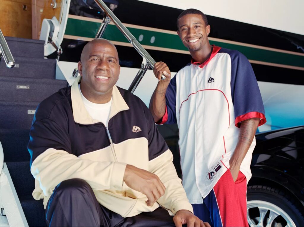 Magic Johnson and his son, Andre Johnson at Van Nuys airport in October, 2005 in Van Nuys, California
