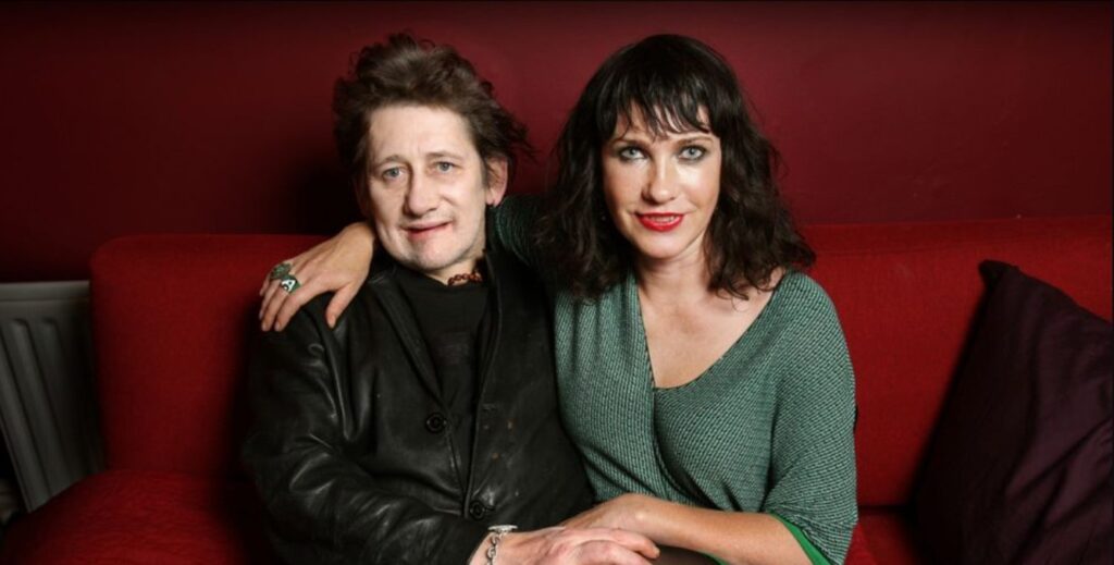 Shane MacGowan (pictured with his wife) has sadly died aged 65. Credit: Getty